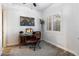 Bright home office with a large window, wooden desk, and comfortable office chair at 2317 W Horsetail Trl, Phoenix, AZ 85085