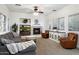 Inviting living room featuring a fireplace, built-in media center, and large windows at 2317 W Horsetail Trl, Phoenix, AZ 85085