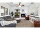 Spacious living room with a cozy fireplace, comfortable seating, and natural light at 2317 W Horsetail Trl, Phoenix, AZ 85085