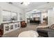 Cozy living room with a fireplace, comfortable seating, and view of the kitchen at 2317 W Horsetail Trl, Phoenix, AZ 85085