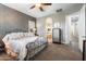 Large Primary bedroom with plush carpet, an ornate bed, and ensuite bathroom access at 2317 W Horsetail Trl, Phoenix, AZ 85085