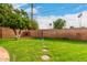 Landscaped backyard with a grassy lawn at 2325 W Orchid Ln, Phoenix, AZ 85021