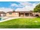 Large backyard with patio, pool and lawn at 2325 W Orchid Ln, Phoenix, AZ 85021
