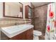 Clean bathroom with updated vanity and shower/tub combo at 2325 W Orchid Ln, Phoenix, AZ 85021