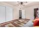 Spacious bedroom with hardwood floors and built-in closet at 2325 W Orchid Ln, Phoenix, AZ 85021