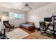 Versatile bedroom with hardwood floors and workspace at 2325 W Orchid Ln, Phoenix, AZ 85021