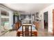Kitchen with granite countertops, wooden table, and pool view at 2325 W Orchid Ln, Phoenix, AZ 85021