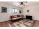 Cozy living room with hardwood floors and a ceiling fan at 2325 W Orchid Ln, Phoenix, AZ 85021