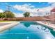 Relaxing kidney shaped pool in the backyard at 2325 W Orchid Ln, Phoenix, AZ 85021