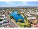 Aerial view of community with lake and mountain views at 240 S Old Litchfield Rd # 107, Litchfield Park, AZ 85340