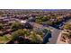 Aerial view of a house in a residential neighborhood with desert landscape at 2699 N Daisy Dr, Florence, AZ 85132