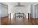 Elegant upstairs hallway with wood floors and a chandelier at 2836 E Dennisport Ct, Gilbert, AZ 85295