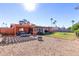 Large backyard with covered patio, fire pit, and ample space for entertaining at 3020 E Des Moines St, Mesa, AZ 85213