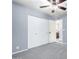 Well-lit bedroom featuring a large closet and access to bathroom at 3020 E Des Moines St, Mesa, AZ 85213