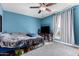 Spacious bedroom with ceiling fan and TV at 3020 E Des Moines St, Mesa, AZ 85213