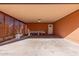 Covered carport with lattice side walls offers extra covered parking and storage at 3020 E Des Moines St, Mesa, AZ 85213