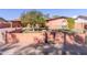 House with a large front yard and mature citrus tree at 3020 E Des Moines St, Mesa, AZ 85213