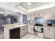 Galley kitchen with ample cabinet space at 3020 E Des Moines St, Mesa, AZ 85213