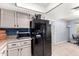 Black refrigerator and granite countertops at 3020 E Des Moines St, Mesa, AZ 85213