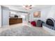 Open living room with kitchen view and a fireplace at 3020 E Des Moines St, Mesa, AZ 85213