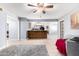 Open concept living room with kitchen and breakfast bar at 3020 E Des Moines St, Mesa, AZ 85213