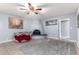 Living room with fireplace, seating area, and ceiling fan at 3020 E Des Moines St, Mesa, AZ 85213