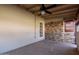 Sunroom featuring a stone accent wall and tiled flooring at 3020 E Des Moines St, Mesa, AZ 85213