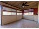 Sunroom with tiled floor, ceiling fan, and multiple windows at 3020 E Des Moines St, Mesa, AZ 85213