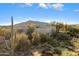 Desert landscape surrounds this stucco home with mountain views at 30600 N Pima Rd # 64, Scottsdale, AZ 85266