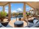 Relaxing patio with a pool view and comfortable seating at 30600 N Pima Rd # 64, Scottsdale, AZ 85266