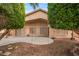 Backyard view showcasing a patio, mature trees, and a house exterior at 3182 N 156Th Ave, Goodyear, AZ 85395