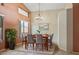 Elegant dining room with a wood table and six chairs at 3182 N 156Th Ave, Goodyear, AZ 85395