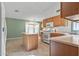 Eat-in kitchen featuring wood cabinets and tile floors at 3182 N 156Th Ave, Goodyear, AZ 85395