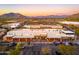 Aerial view of a shopping center with various stores and ample parking at 32427 N 71St Way, Scottsdale, AZ 85266