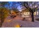 Serene backyard with a fountain, string lights, and desert landscaping, perfect for relaxation at 32427 N 71St Way, Scottsdale, AZ 85266