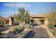 Community entrance with tile roof, stone accents, and landscaping at 3722 N Sonoran Hls, Mesa, AZ 85207