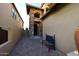 Courtyard entry with a bench and brick pavers leading to the front door at 3722 N Sonoran Hls, Mesa, AZ 85207