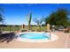 Community hot tub with desert landscaping, fence, and mountain views at 3722 N Sonoran Hls, Mesa, AZ 85207