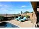 Inviting pool area with lounge chairs and desert plants at 3722 N Sonoran Hls, Mesa, AZ 85207