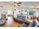 Spacious living room with hardwood floors and a ceiling fan at 420 S Oak St, Gilbert, AZ 85233