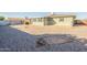 Backyard view of house with gravel and AC unit at 5155 E Farmdale Ave, Mesa, AZ 85206