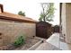 Private backyard with storage shed, raised garden bed, and block wall at 5812 E Grandview Rd, Scottsdale, AZ 85254