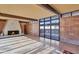 Living room with a fireplace and expansive windows overlooking backyard at 6105 N Camelback Manor Dr, Paradise Valley, AZ 85253