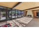 Living room with a stone fireplace and large windows offering scenic views at 6105 N Camelback Manor Dr, Paradise Valley, AZ 85253