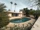 Kidney-shaped pool with a view of the back of the house at 6615 E Cheney Dr, Paradise Valley, AZ 85253