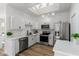 Bright and updated kitchen featuring white cabinetry and sleek appliances at 7006 E Jensen St # 111, Mesa, AZ 85207