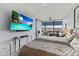Bright bedroom featuring a large TV and city view at 7180 E Kierland Blvd # 311, Scottsdale, AZ 85254