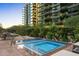 Community hot tub with seating and surrounding greenery at 7180 E Kierland Blvd # 311, Scottsdale, AZ 85254