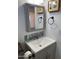 Updated bathroom with gray vanity and a framed mirror at 7750 E Broadway Rd # 911, Mesa, AZ 85208