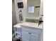 Clean bathroom, featuring a white vanity and marble shower at 7750 E Broadway Rd # 911, Mesa, AZ 85208